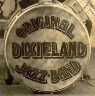An enhanced photograph of a closeup of the logo of The Original Dixieland Jazz Band on the front of their bass drum.