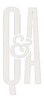 A transparent graphic of a logo with the capital letters "Q & A."
