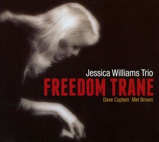 The album cover for the Jessica Williams trio with her bent over a piano facing right on left side of cover with the title of "Freedom Trane" and the trio's name on right side of cover.