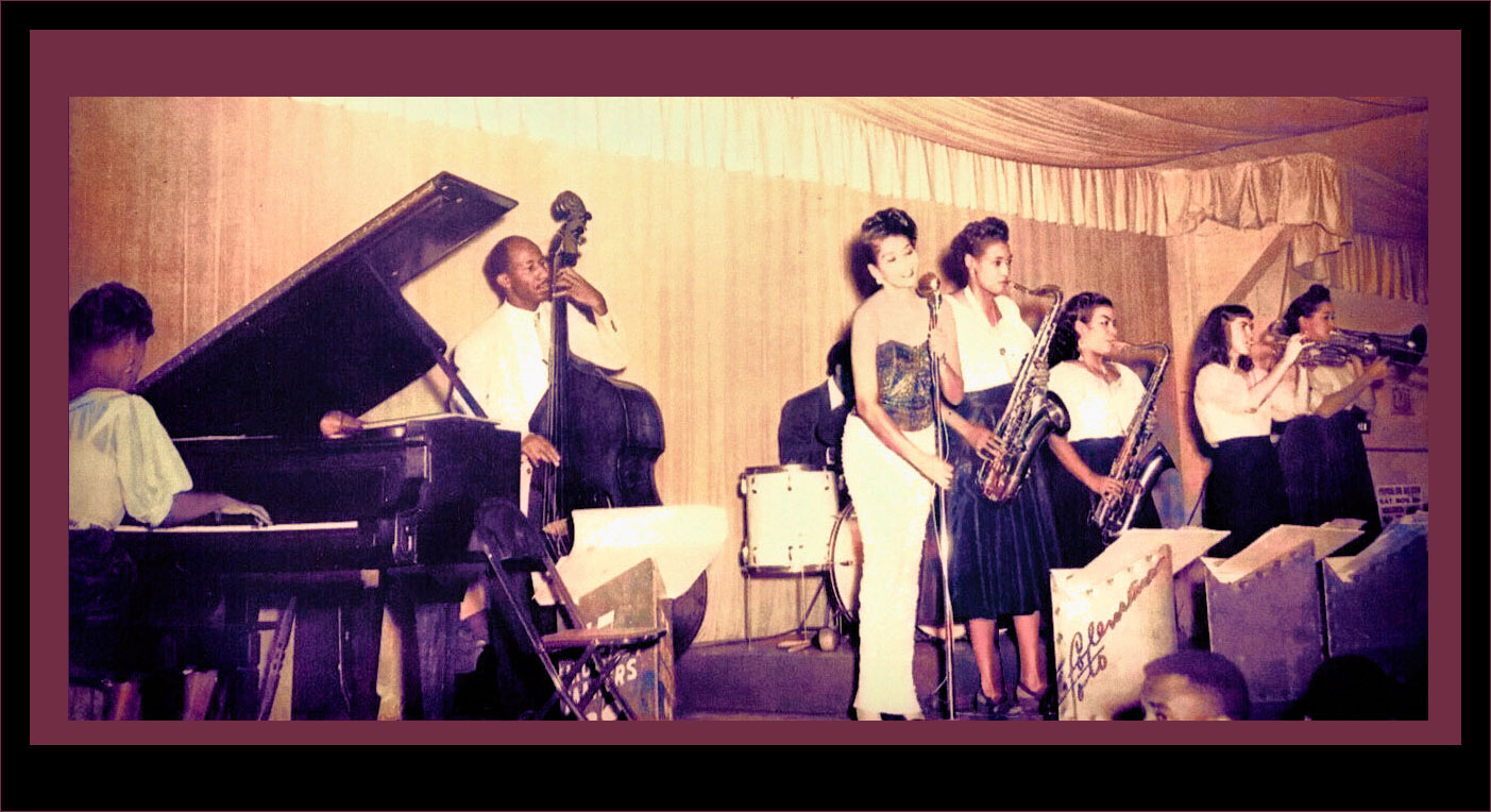 A colorized photo of the almost all woman band at the Palomar ballroom surrounded by outside frames around photograph.