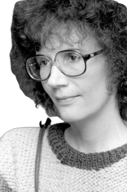 A photograph by Italian photographer Paolo Gialappait (with his permission) of Joanne Brackeen as a younger woman with eyeglasses and frizzy hair looking to her left.