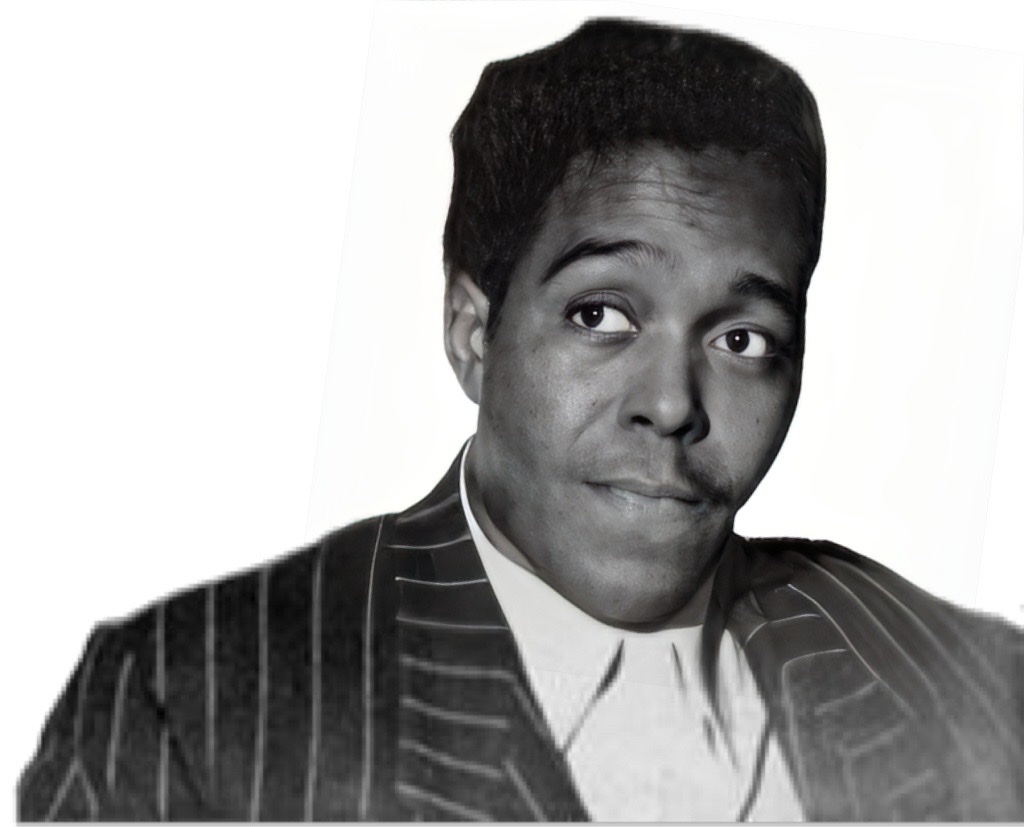 A sober Charlie Parker with a modest expression on his face wearing an attractive pin-striped suit and without his saxophone.