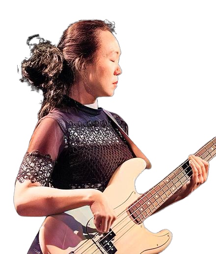 A colorized photograph of Linda May Han Oh in right profile turning towards her left playing her electric bass in Oslo, Norway in 2019.