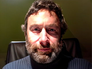 An enhanced color headshot of Alessandro Bertinetto with full beard.