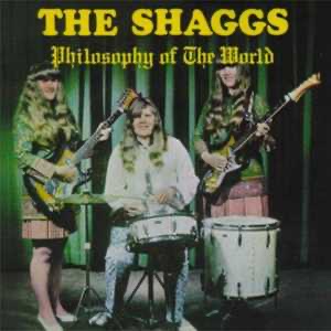 The Shaggs album cover for "Philosophy of  the World" of the three women with instruments, drummer in center, with a green curtained backdrop.