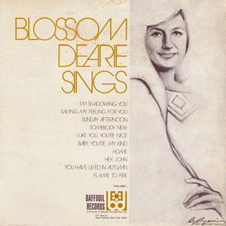 The album cover for "Blossom Dearie Sings" with a drawing of  her on right side and song titles listed on left side.