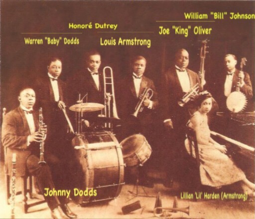 King Oliver's Creole Jazz Band in Chicago (1923)  alt=A black and white photograph with musician's names labeled by each one of King Oliver's Creole Orchestra in 1923 with King Oliver centered in the background and Louis Armstrong playing trumpet and Lil Harden (Armstrong) seated at the piano with other band members on either side playing their instruments.