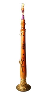 A cutout photograph of a shehnai, which is an oboe-like musical instrument.