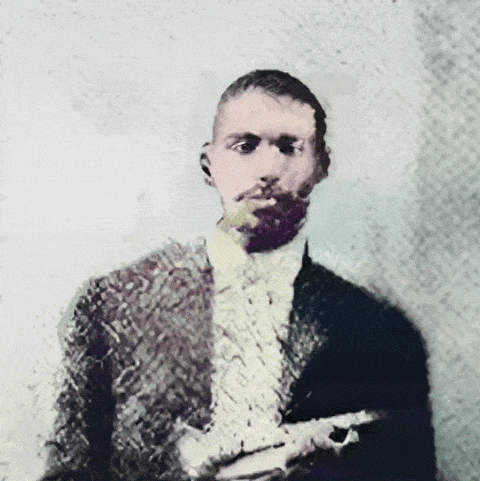 An enhanced and colorized animated .gif of Buddy Bolden holding his trumpet in his left hand at chest height.