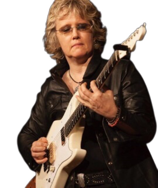 A color photograph of Sheryl Bailey playing her white guitar.