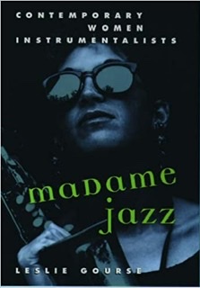 The book cover for Madame Jazz: Contemporary Women Innstrumentalists with a closeup of the head of a woman in sunglasses holding a saxophone with her right hand inside the mouth of the horn.