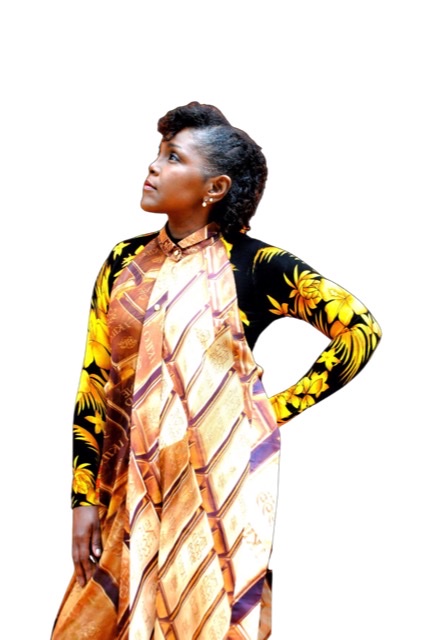 A color photographic cutout of Nubya Garcia in reversed right profile holding her head up with a colorful white dress and yellow and black sleeve.