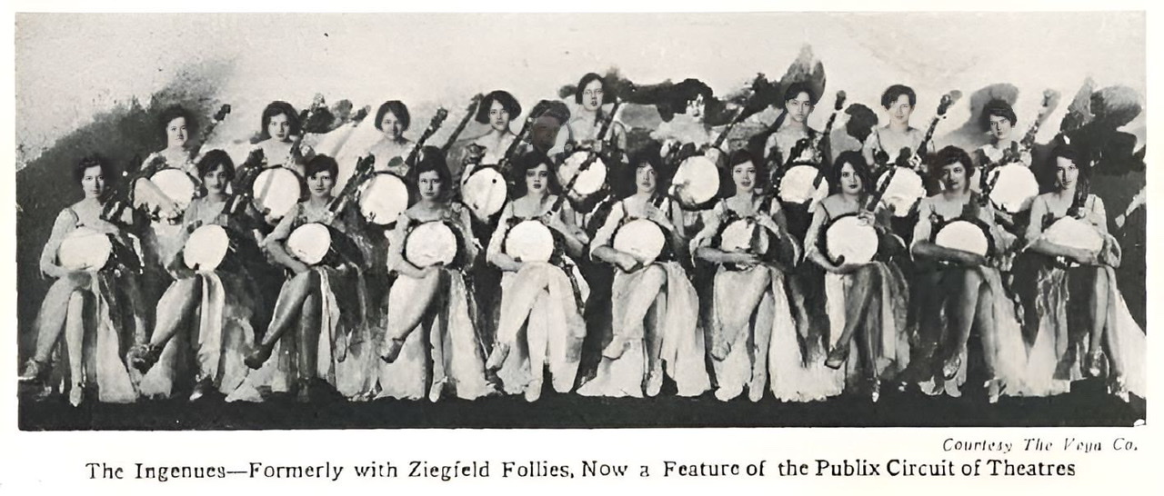 An enhanced black and white photograph of nineteen of The Ingenues sitting in two rows each holding a banjo 🪕.