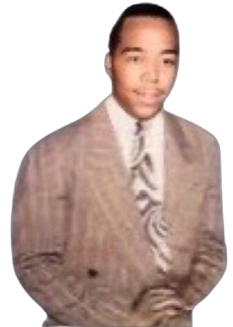 A cutout detail from a colorized black and white photograph where Charlie Parker faces the camera having a wispy mustache wearing a classy suit with wide stripes and an art deco patterned tie.