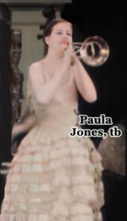 An enhanced and colorized screenshot detail of trombonist Paula Jones playing her instrument in the short film "The Band Beautiful."
